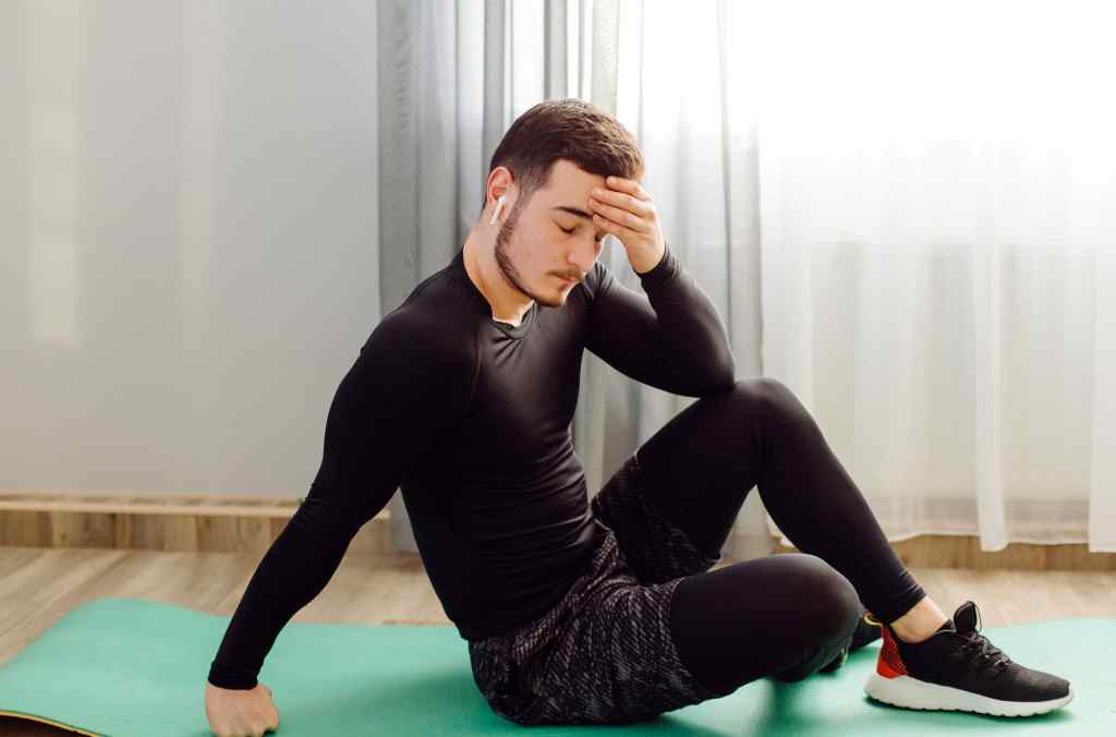 man making sport exercises at home