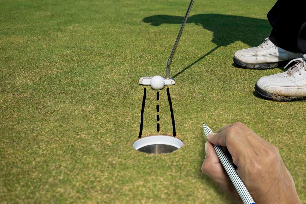 Golfer putting golf ball under sunshine